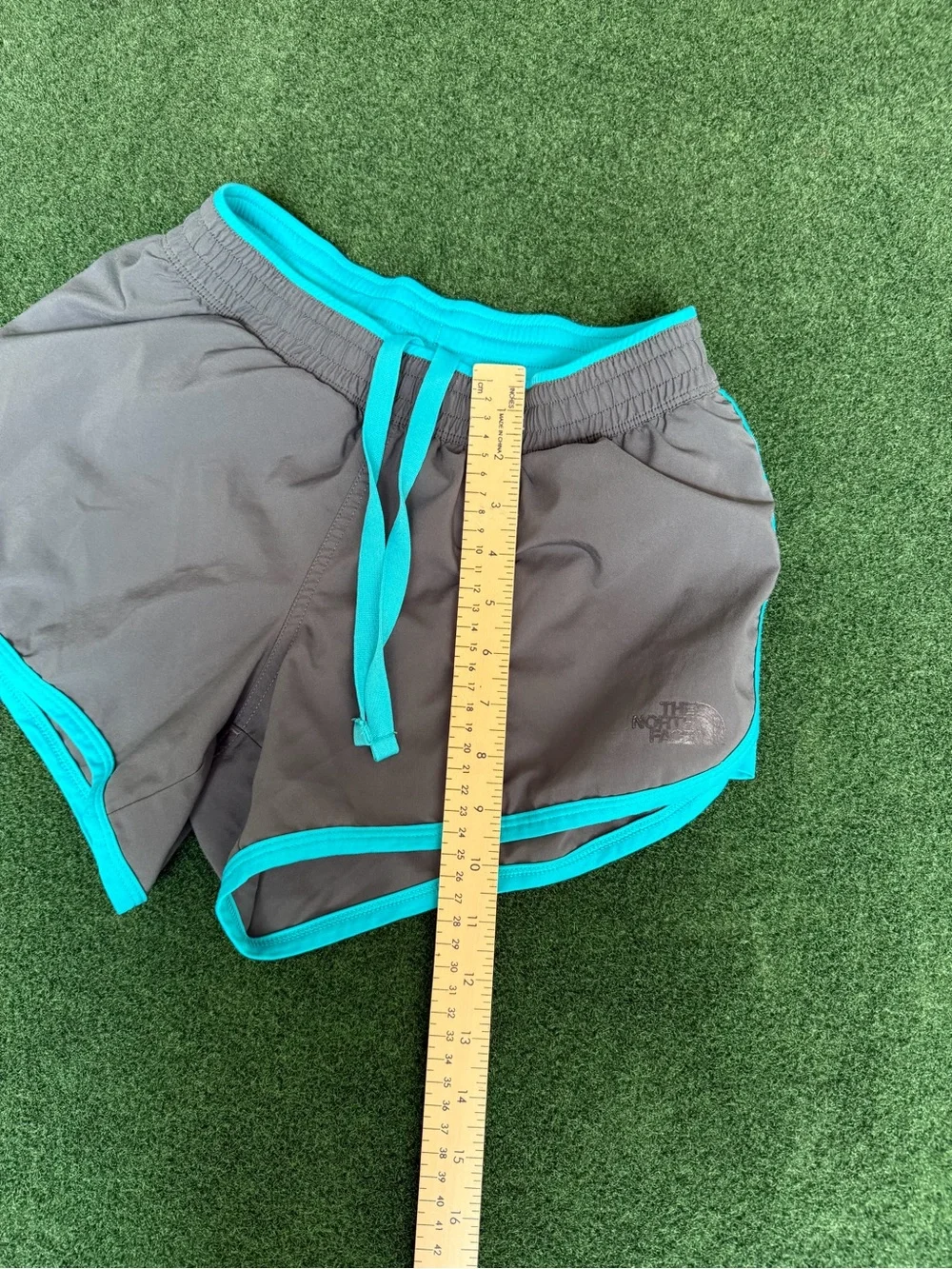 The North Face Women’s Gray Athletic Shorts with Teal Trim